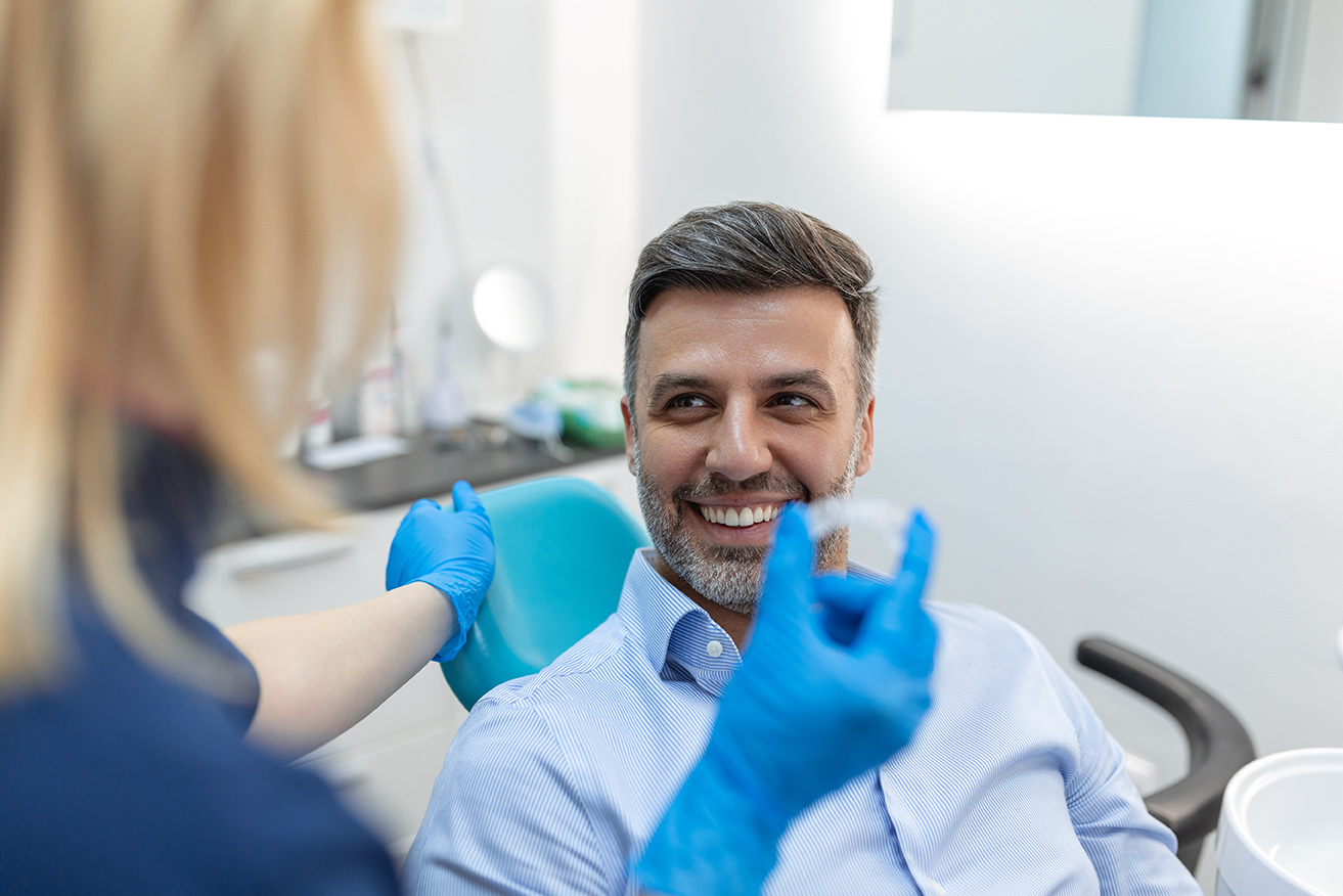 dental patient and dr tien do during invisalign consultation at medford main street dental