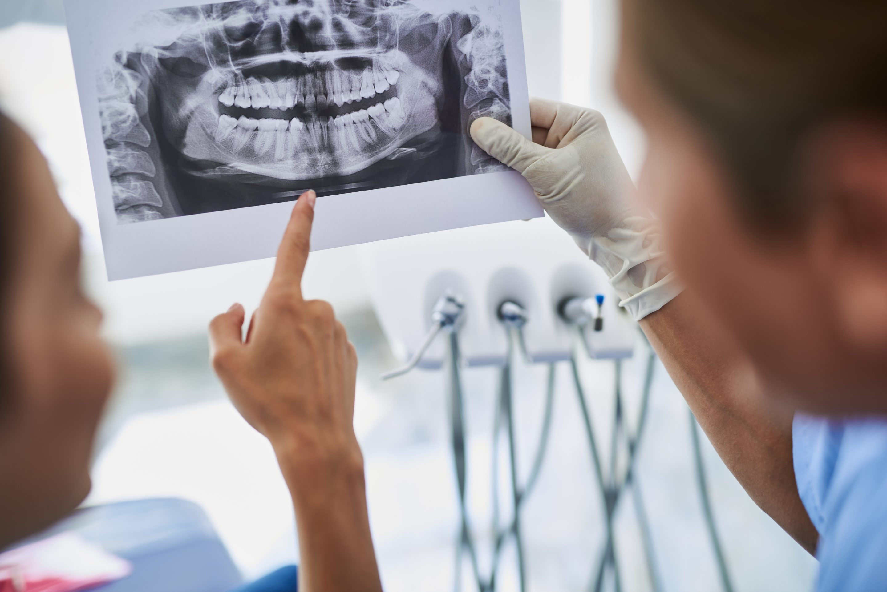 dr do and implant dental patient looking at dental xray at medford main street dental