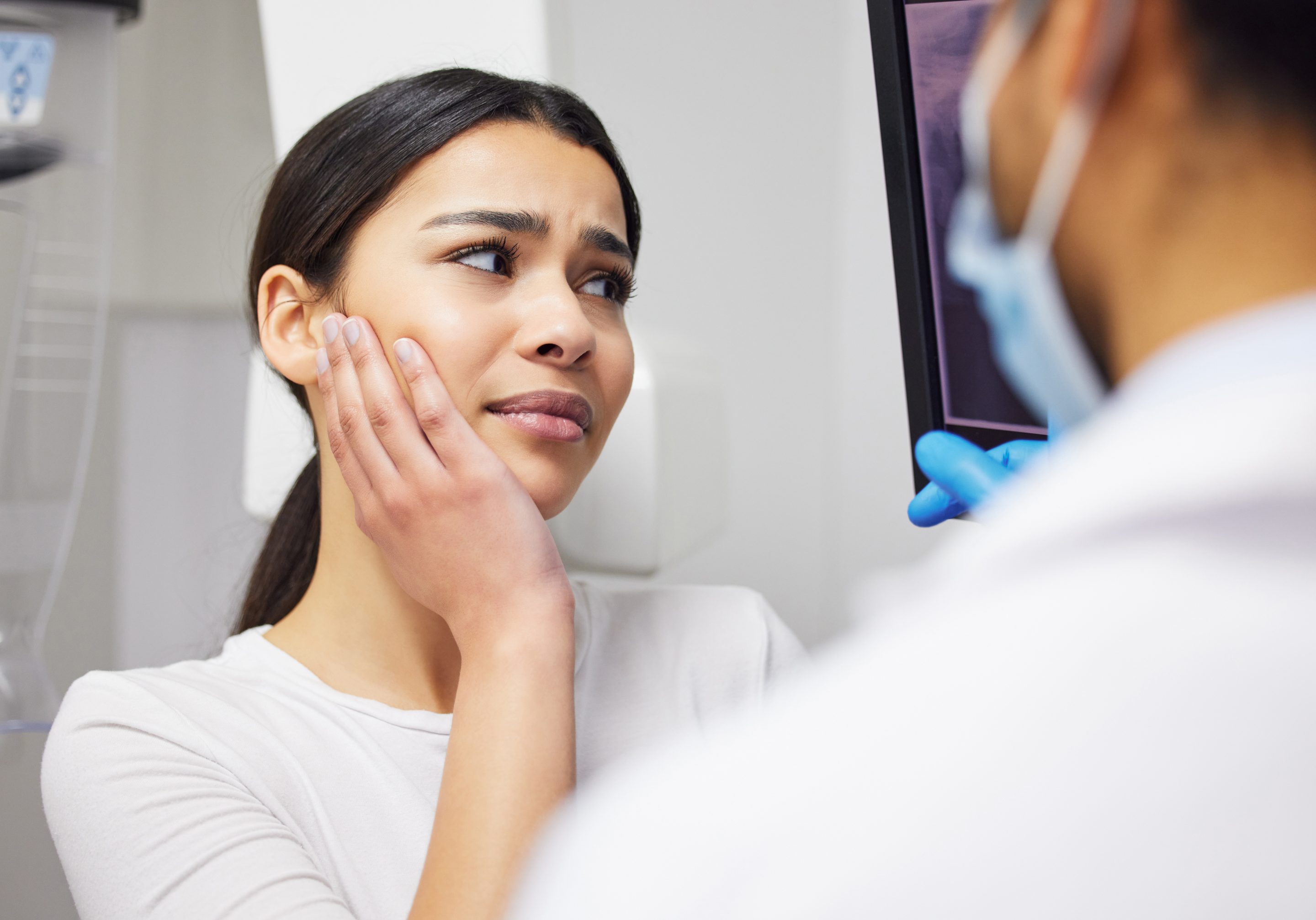 dental patient talking with dr do about Implant Dental Care