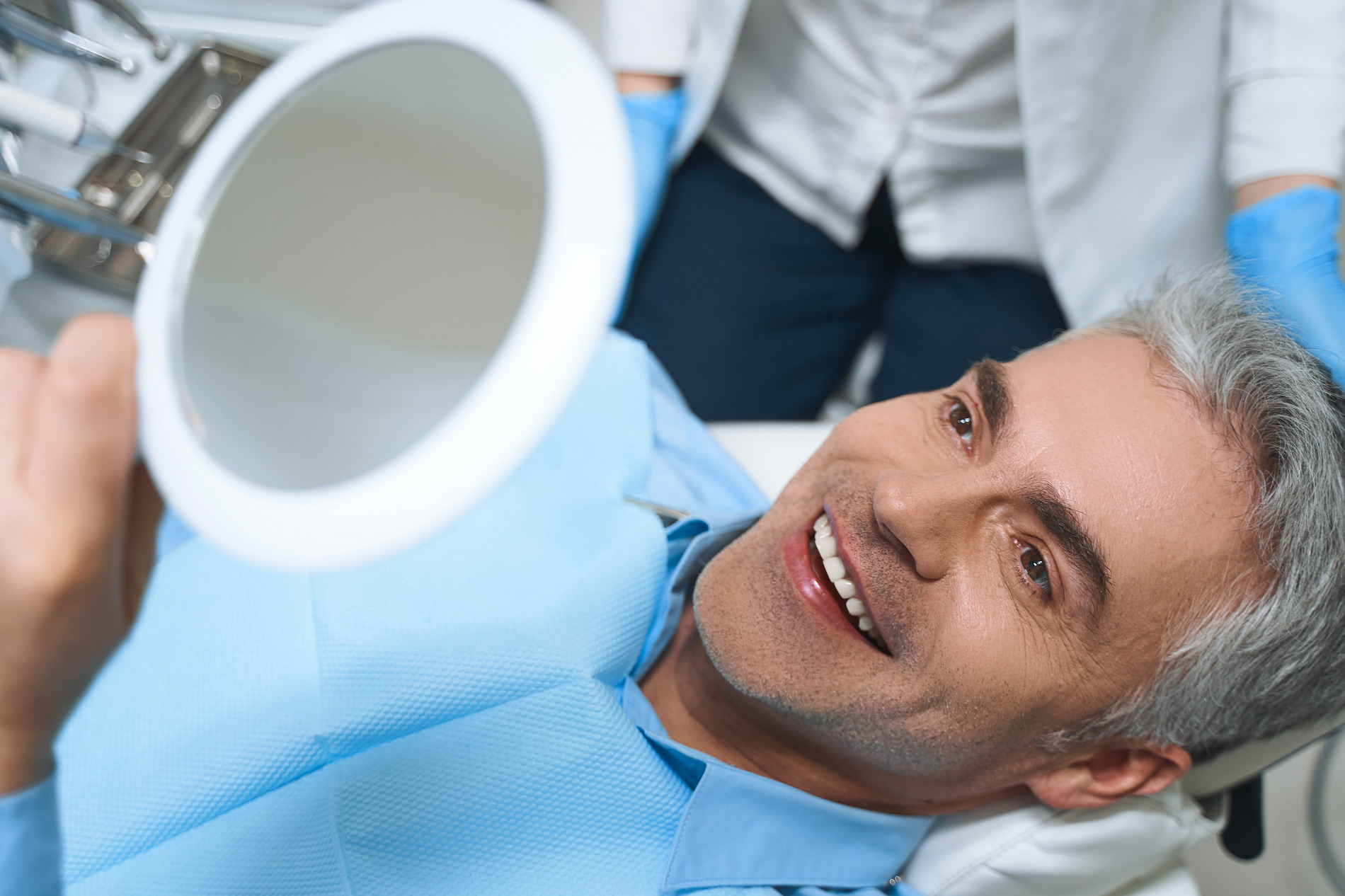 Man feeling excited with his professional dental cleaning in Medford MA