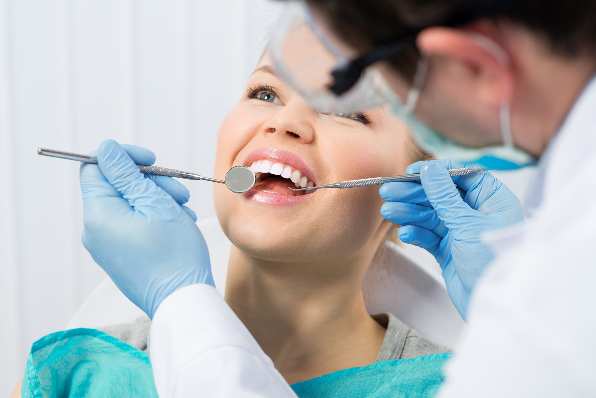 Woman getting her teeth cleaned wit Dr. Do in Medford, MA