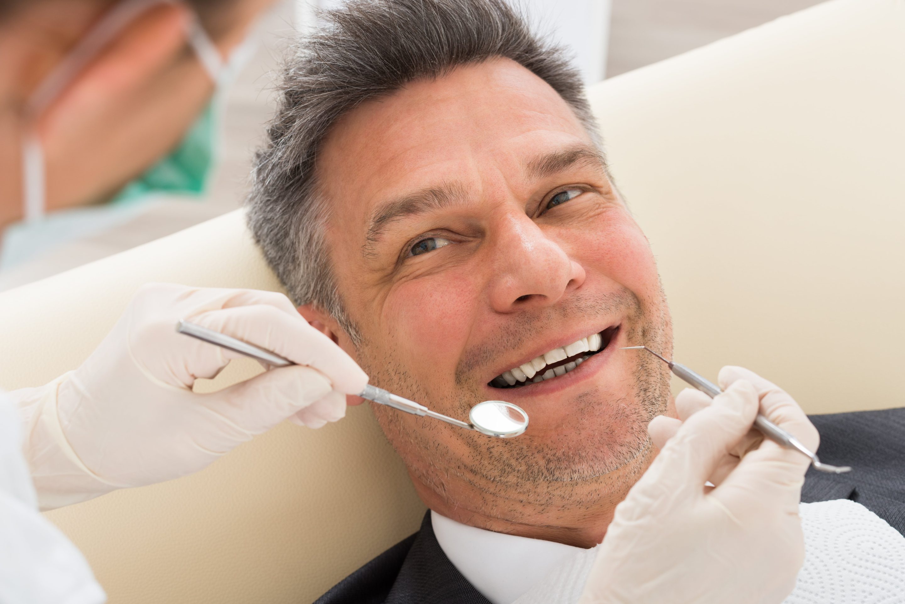 Man getting a single tooth implant from Dr. Do at Medford Main Street Dental P.C.