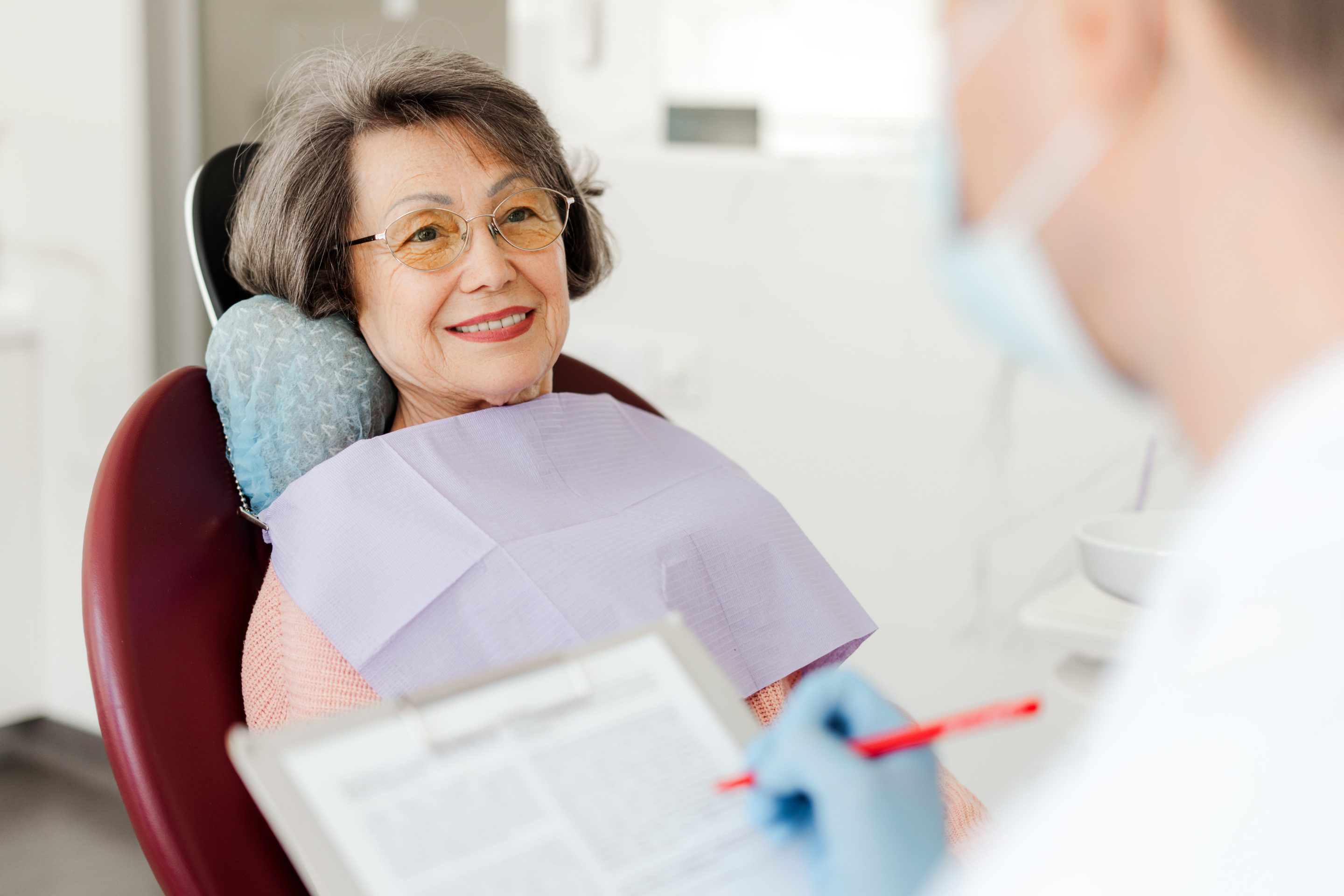 Woman at her first implant consultation in Medford MA