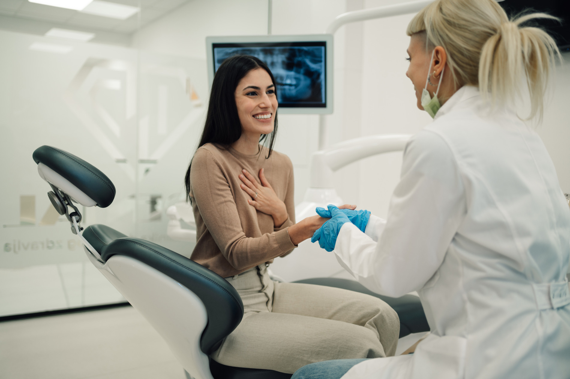Woman discussing her extraction with Dr. Do