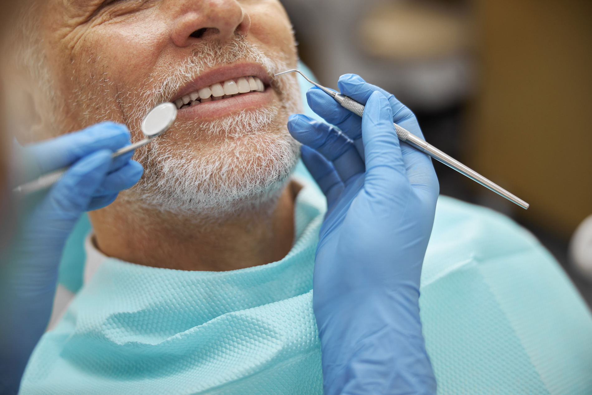 Man recieving a dental extraction in Medford MA